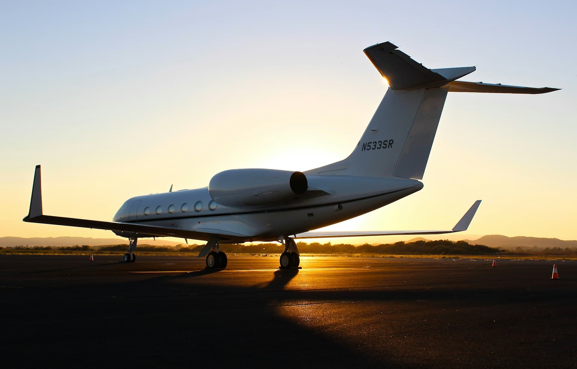 VOLO private jet taking off at sunset — AI-native luxury charter aviation